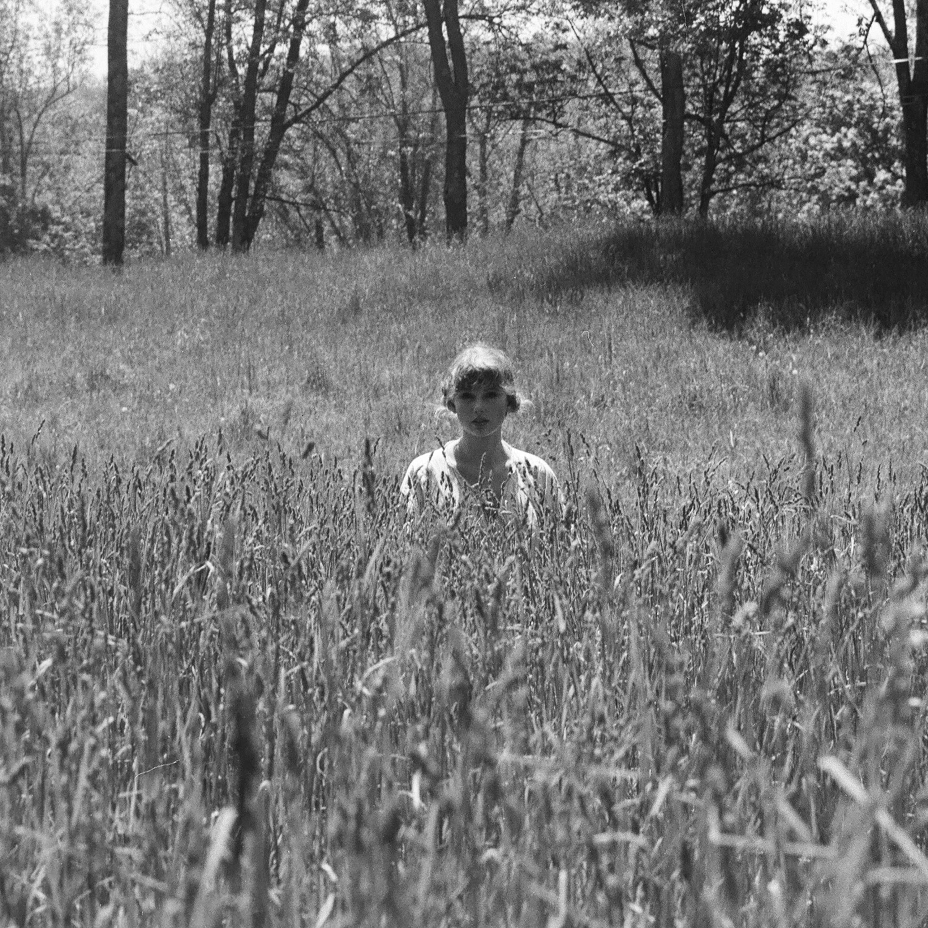 taylor swift standing in a field